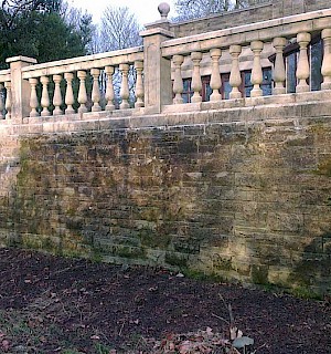 Steps and balustrade stone wall before