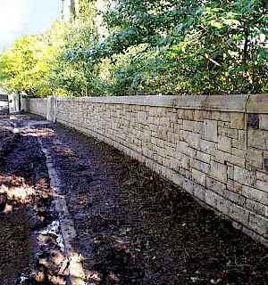 External stone wall after pressure washing